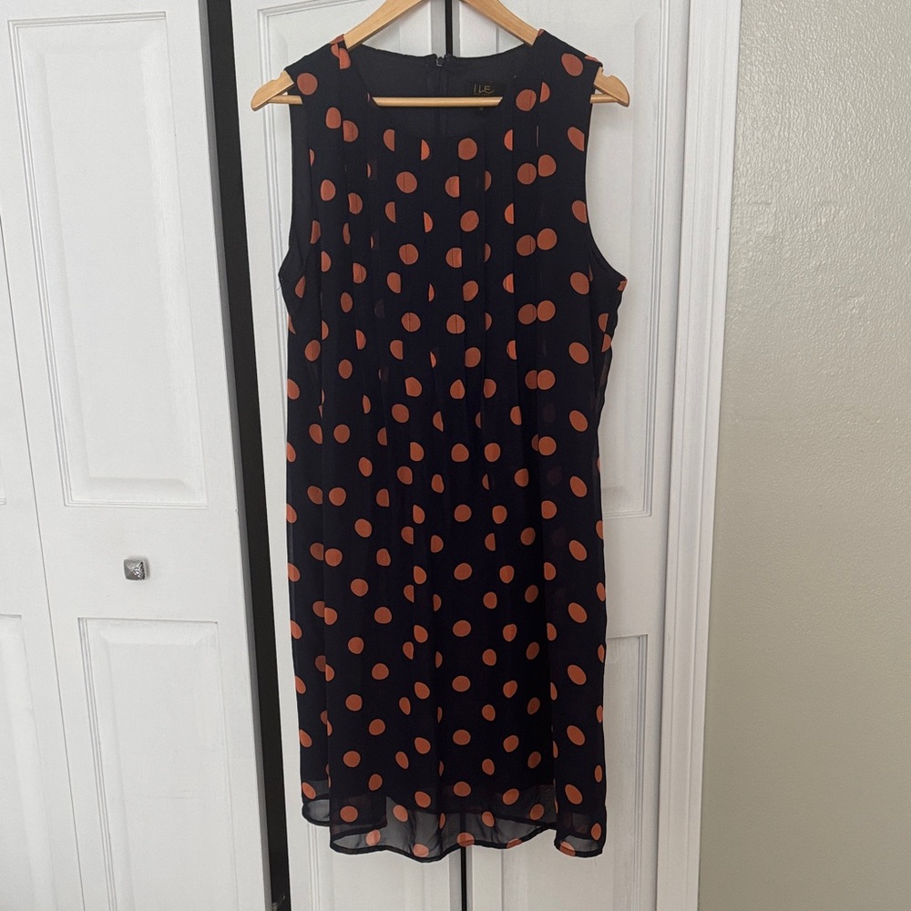 Chic Navy Midi Dress with Vibrant Orange Dots